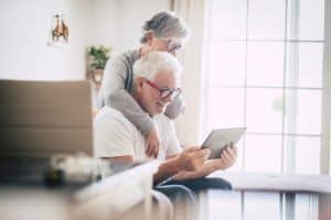 older couple looking at an ipad