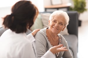 a doctor talking to an older woman